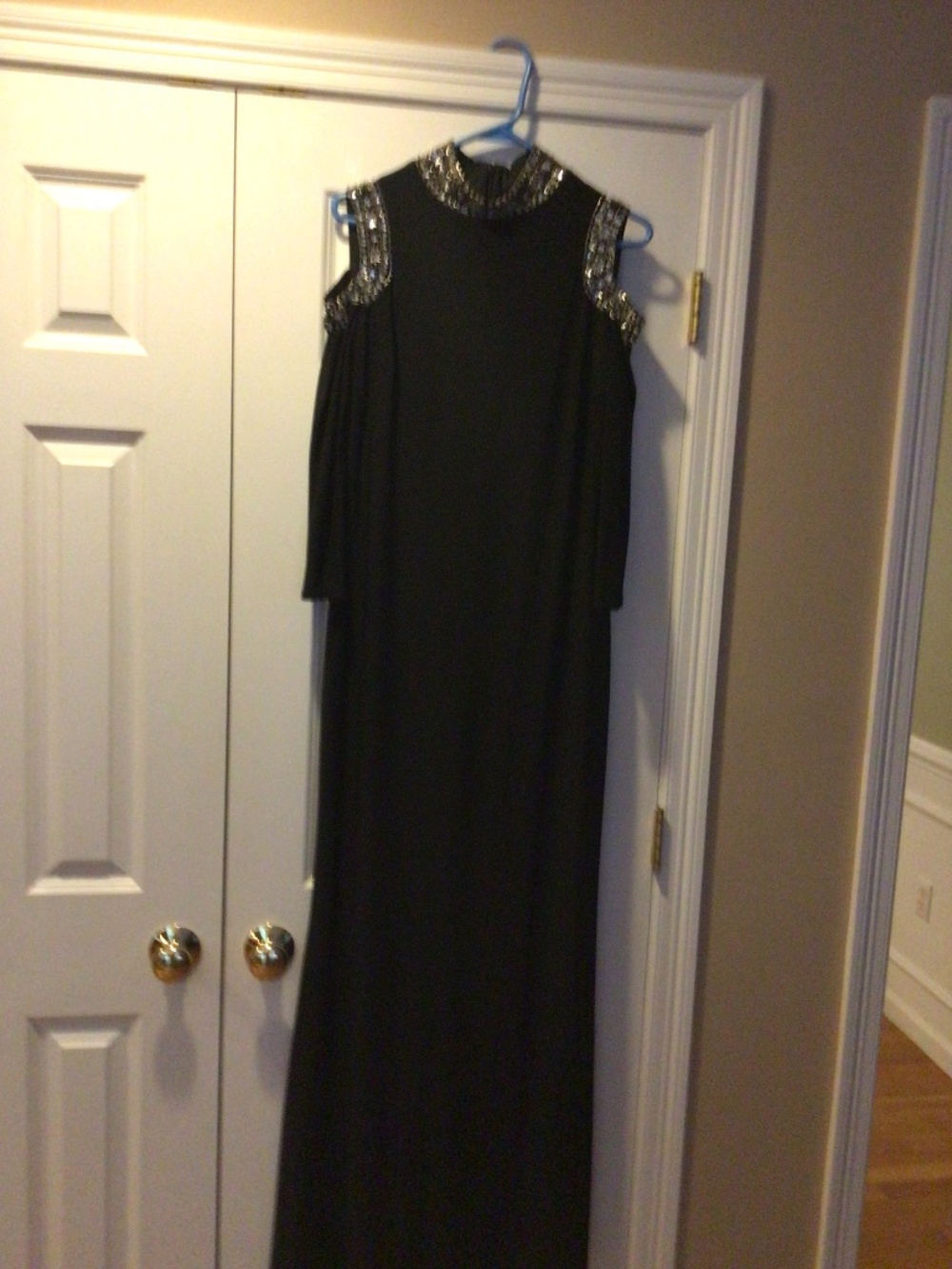 Black jersey gown with cold shoulder design, embellished rhinestone/sequins